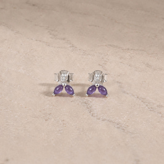 Sterling silver amethyst marquise stud earrings with smooth cabochon gemstones.
