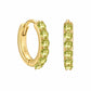 Pair of 14ct gold vermeil huggie hoop earrings with six faceted light green peridot gemstones in a claw setting, shown from front and angled views on a white background with a polished finish.