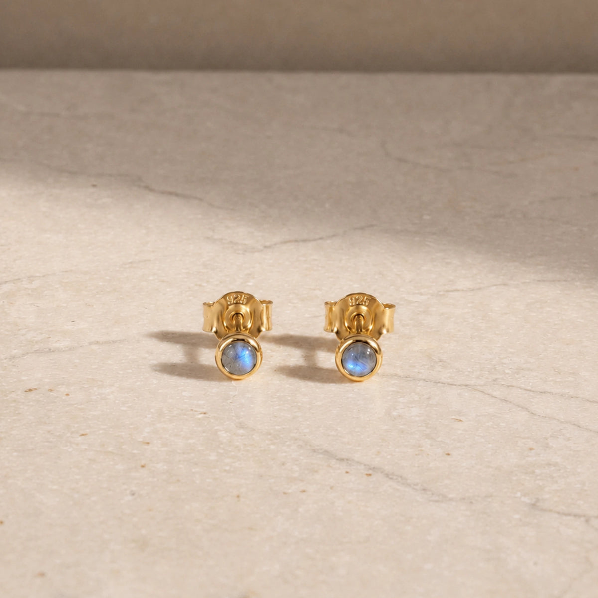 14ct gold vermeil labradorite stud earrings with round cabochon gemstones.