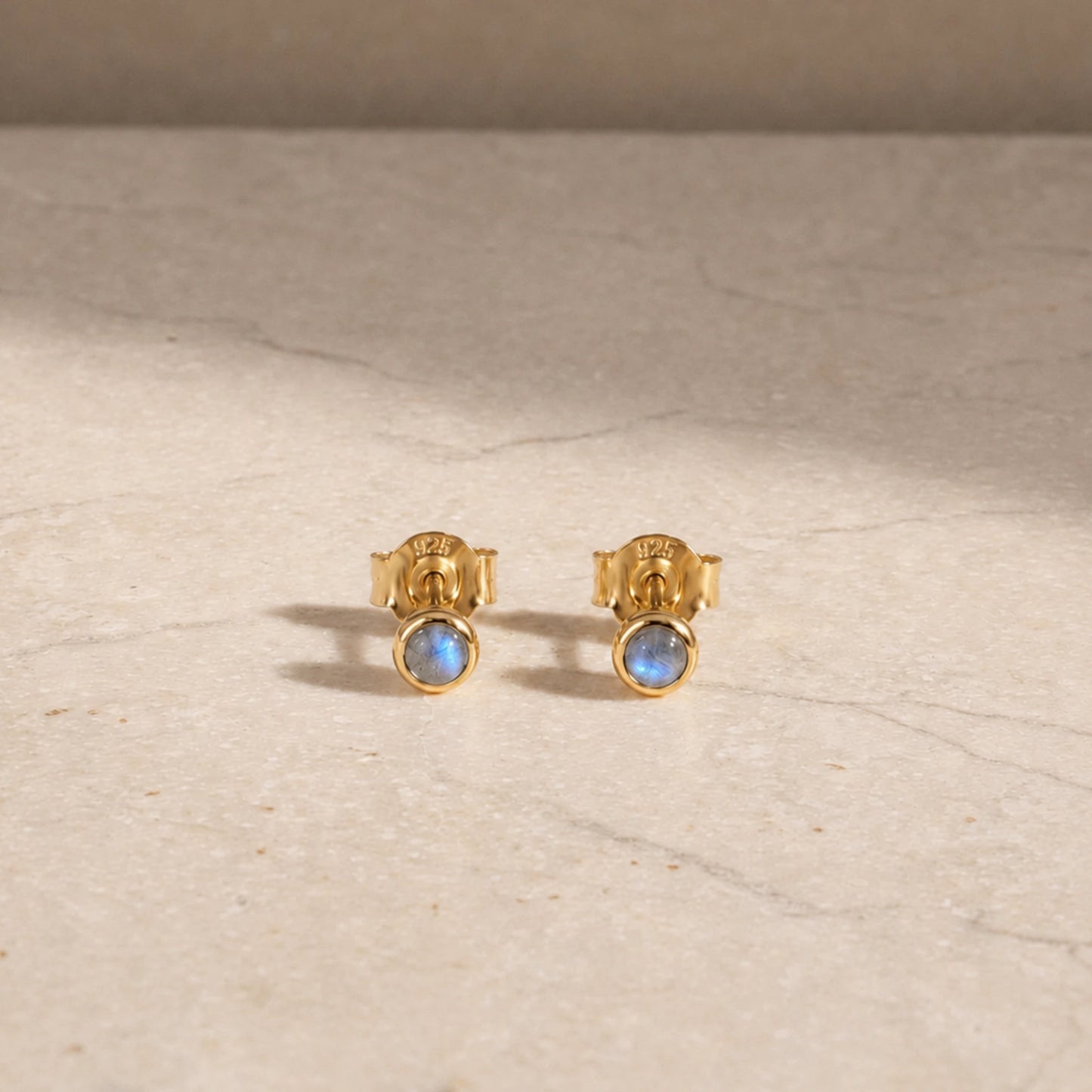 14ct gold vermeil labradorite stud earrings with round cabochon gemstones.