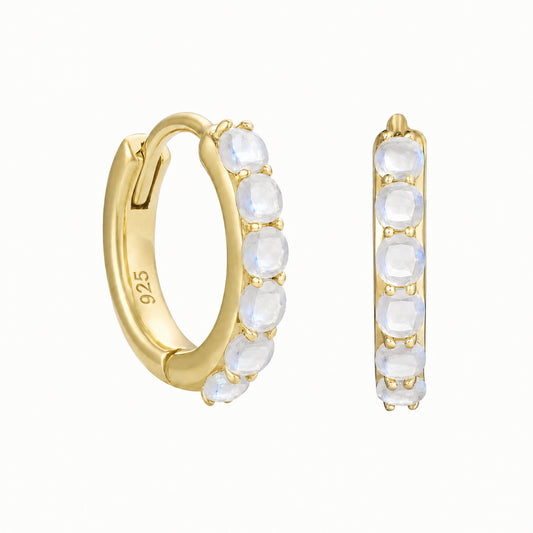 Pair of 14ct gold vermeil huggie hoop earrings featuring six faceted rainbow moonstones in a claw setting. One earring is shown angled to display the 925 hallmark, with the other shown from the front on a white background.