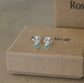 Front view of sterling silver round amazonite stud earrings with 925 butterfly backs displayed on a beige jewellery box.