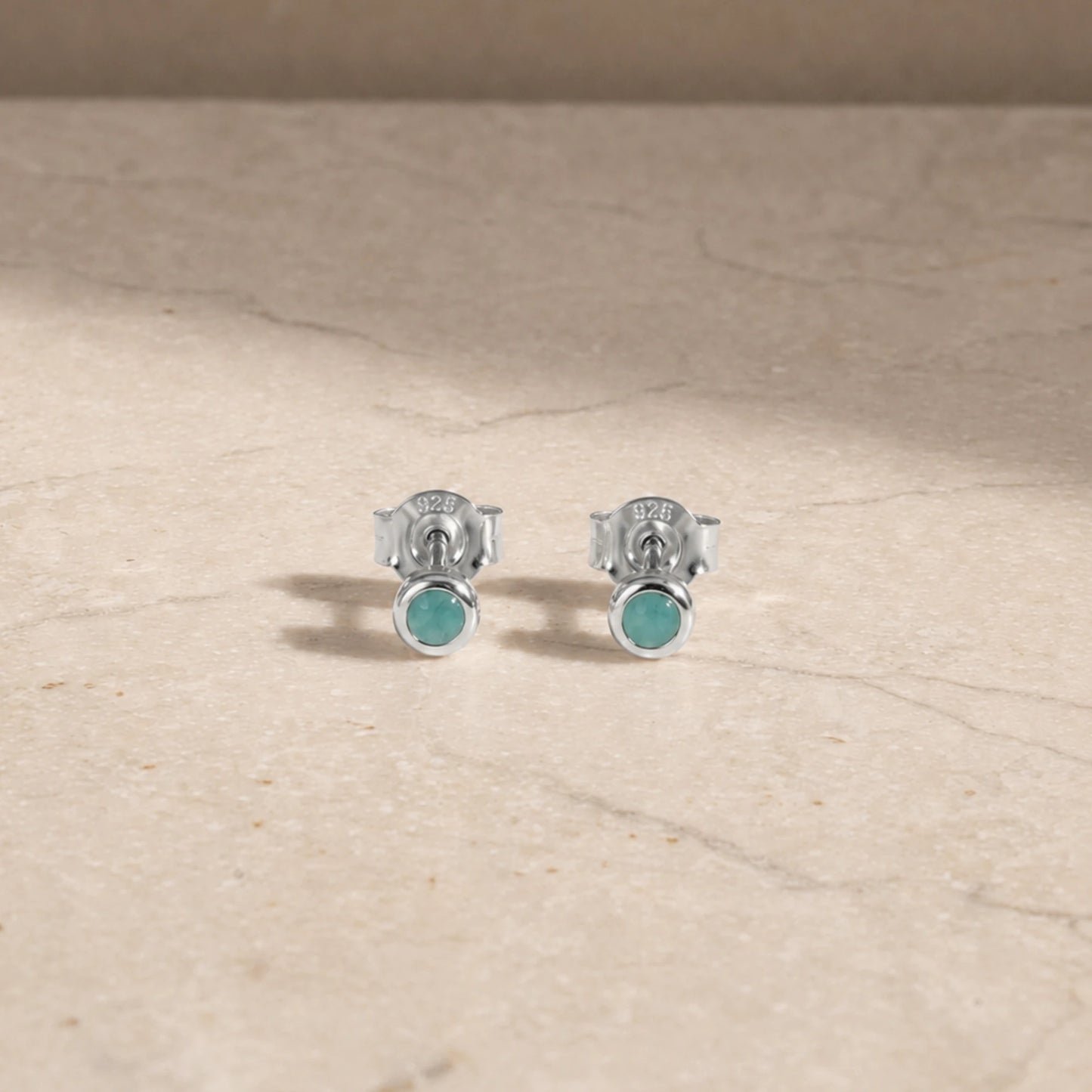 Sterling silver amazonite stud earrings with round cabochon gemstones.