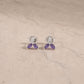 Sterling silver amethyst marquise stud earrings with smooth cabochon gemstones.