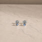 Sterling silver labradorite stud earrings with round cabochon gemstones.